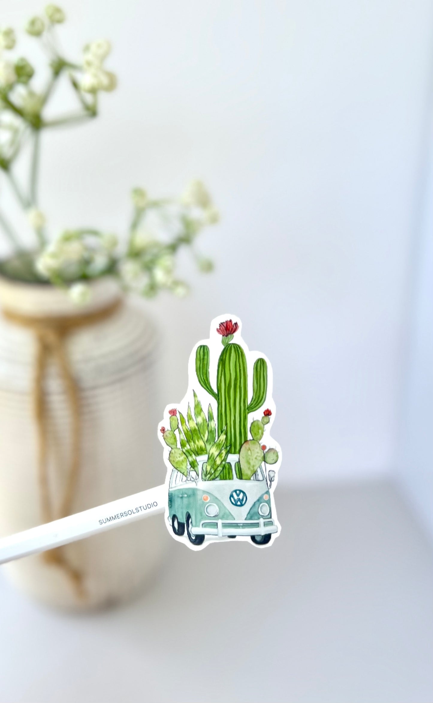 retro camper van filled with cacti